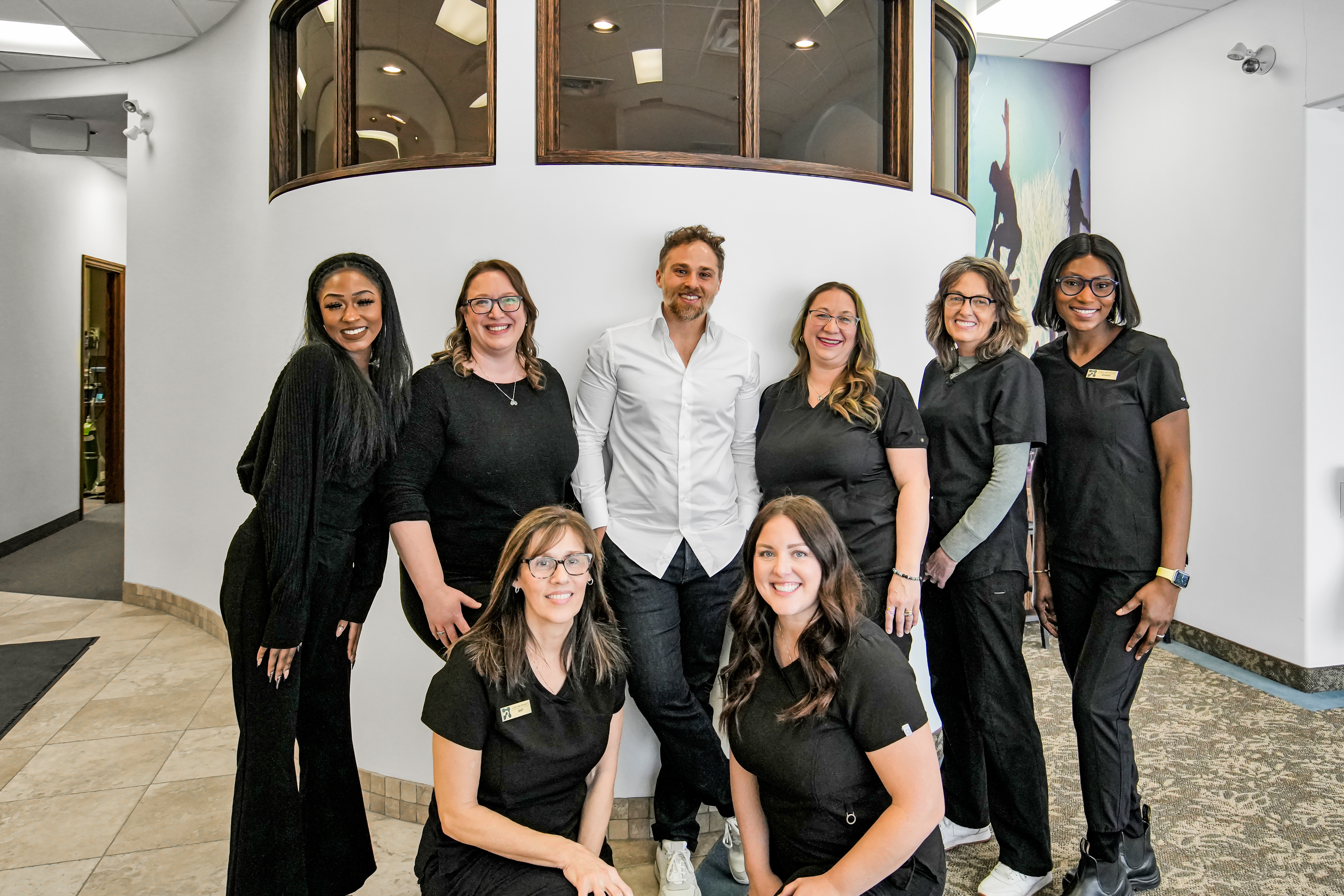 Root Cause Dental Group team portrait inside the clinic